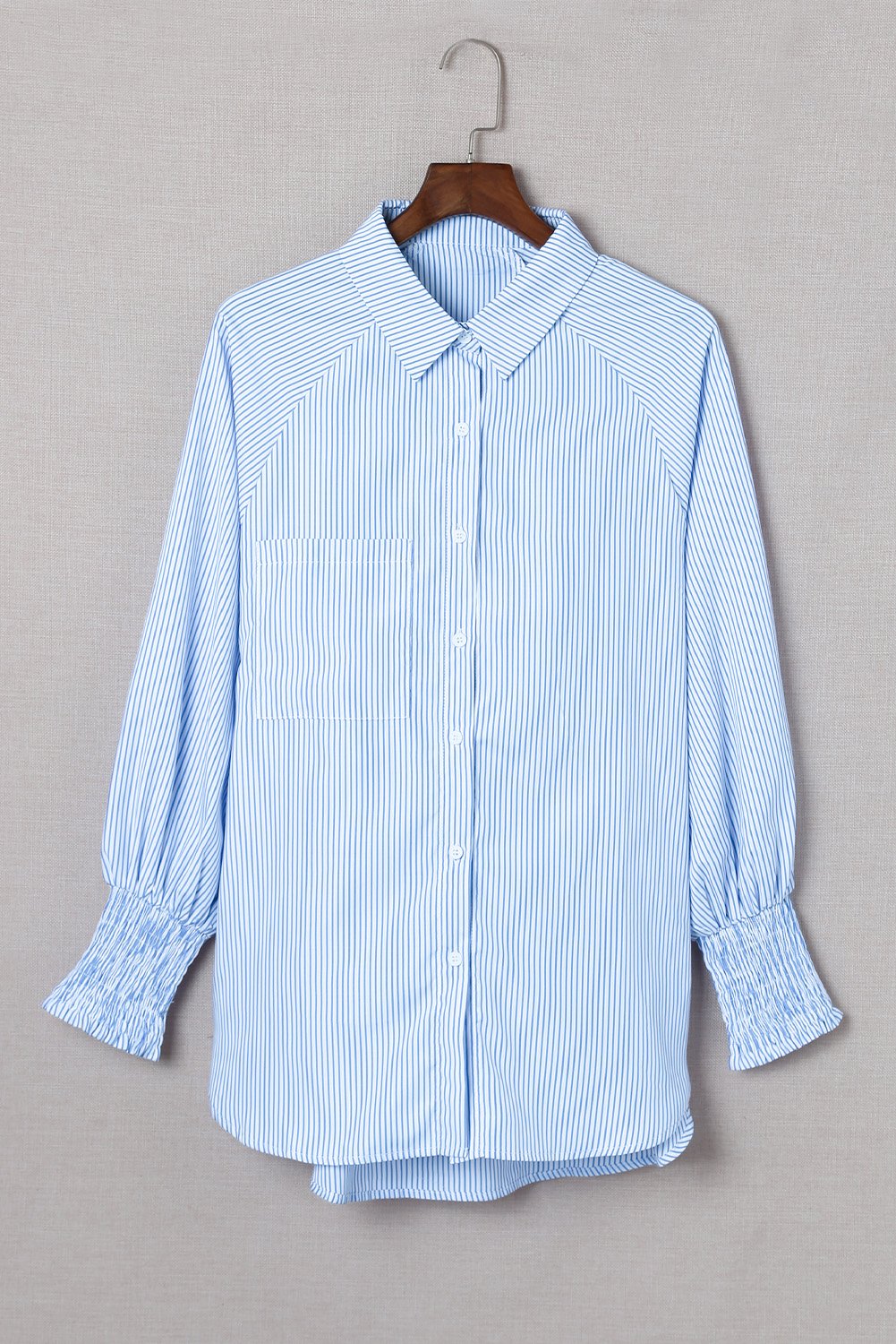 Mid-length shirt with striped lapel and oversized drawdown sleeves